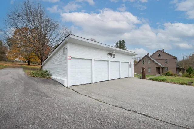 a bathroom with a toilet a sink and tub