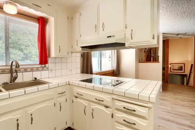 a room with two bed and a window