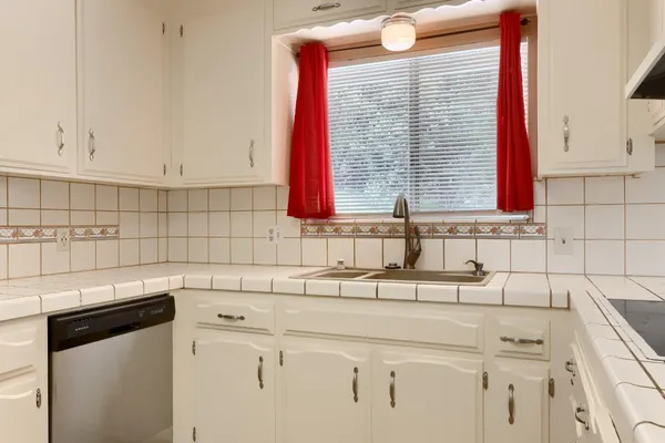 a white refrigerator freezer sitting in a kitchen