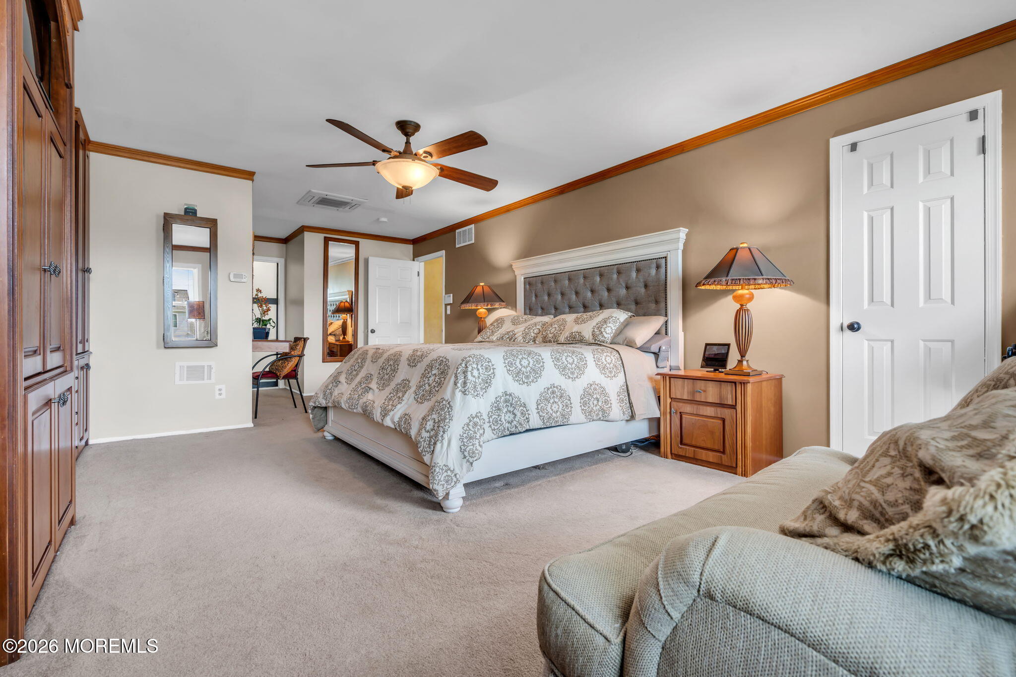 21 Ryan Road Marlboro, NJ 07746 - Photo 21 of 56 a bedroom with a bed and a chandelier