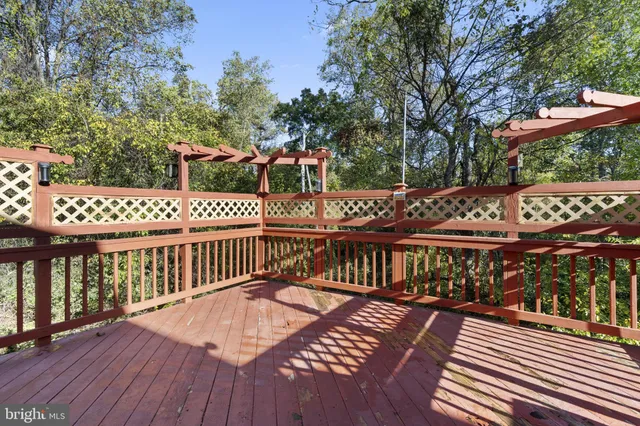 a view of a wooden deck with furniture