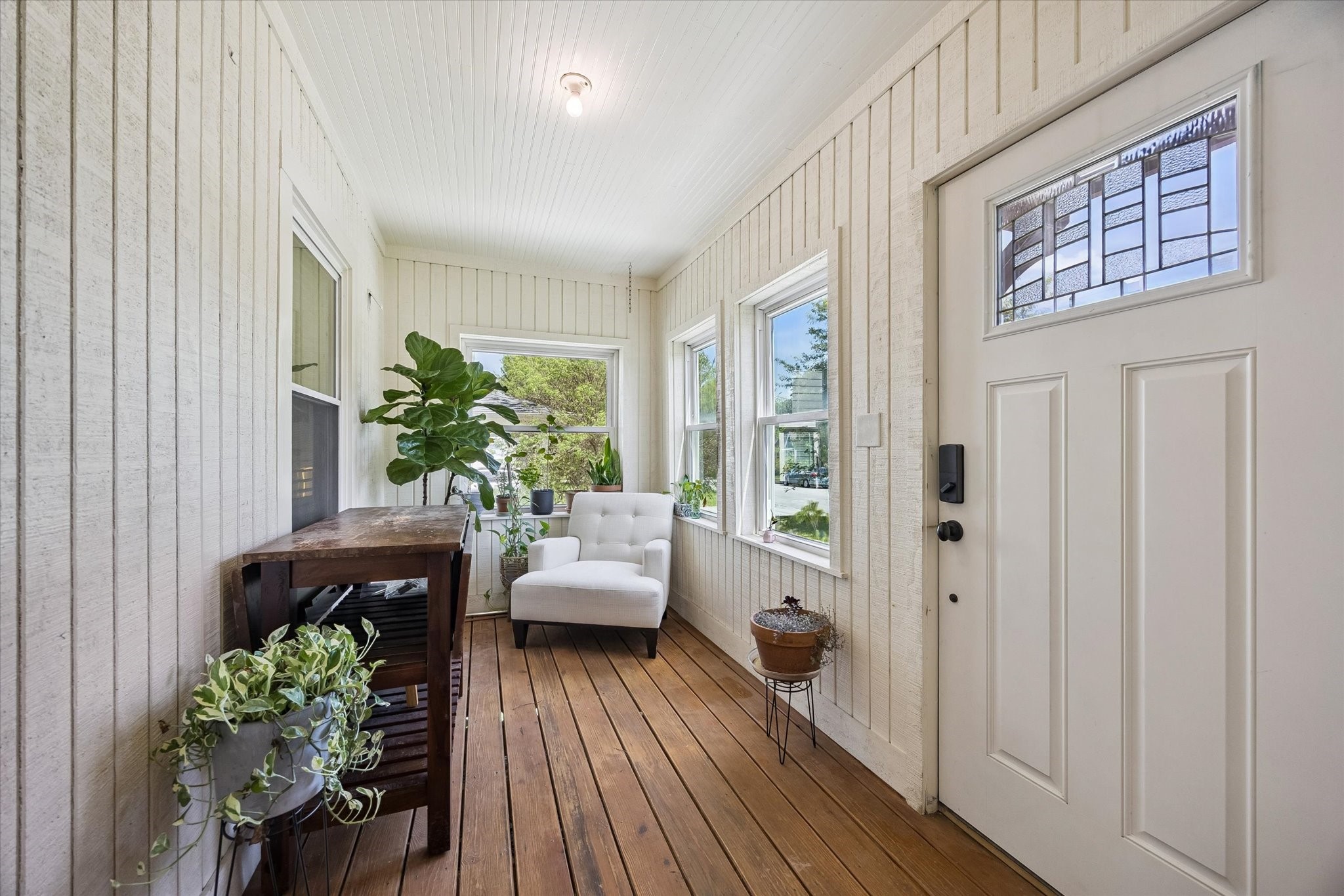 809 Gale Street Houston, TX 77009 - Photo 2 of 18 Bright enclosed entry porch with wood flooring, abundant windows, and space for seating.