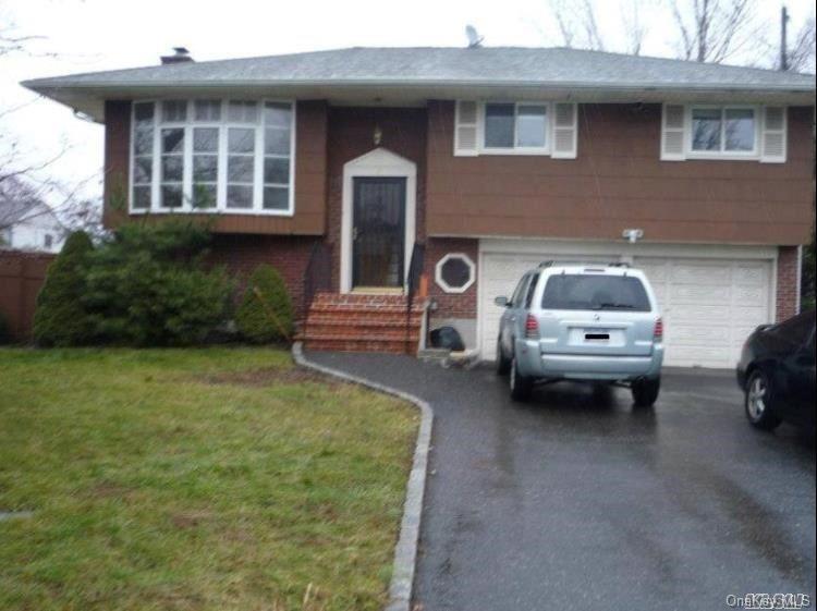 183 Wright Avenue Deer Park, NY 11729 - Photo 1 of 1 a car parked in front of a house