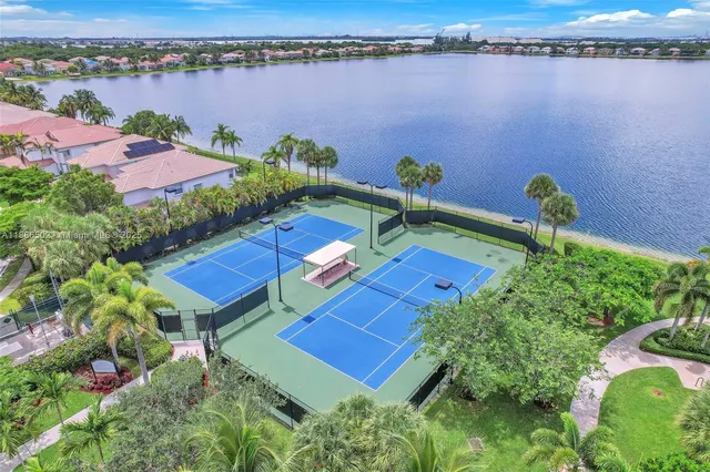 an aerial view of a house with a lake view