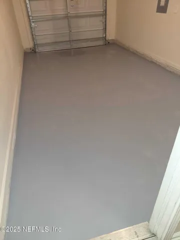 a kitchen with stainless steel appliances a sink a stove a refrigerator cabinets and a center island