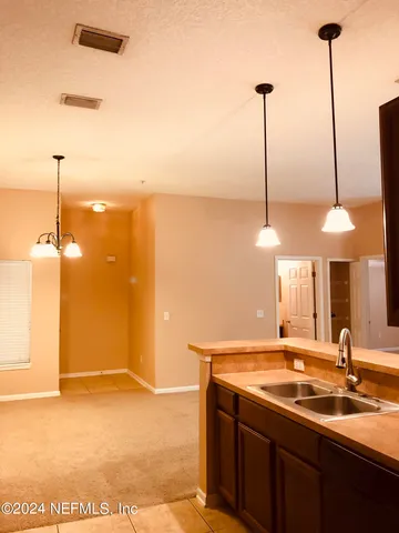 a bathroom with a sink a mirror and a shower