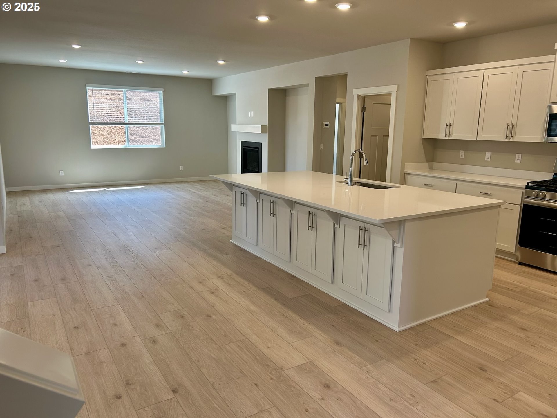 14956 Southwest 165th Avenue Tigard, OR 97224 - Photo 26 of 43 a large kitchen with stainless steel appliances granite countertop a large counter top and a wooden floors