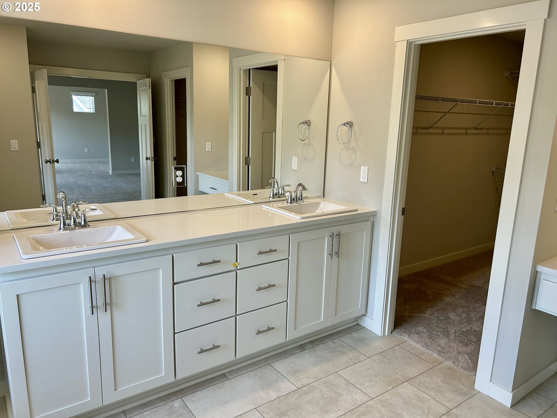 14956 Southwest 165th Avenue Tigard, OR 97224 - Photo 31 of 43 a bathroom with a double vanity sink and a mirror