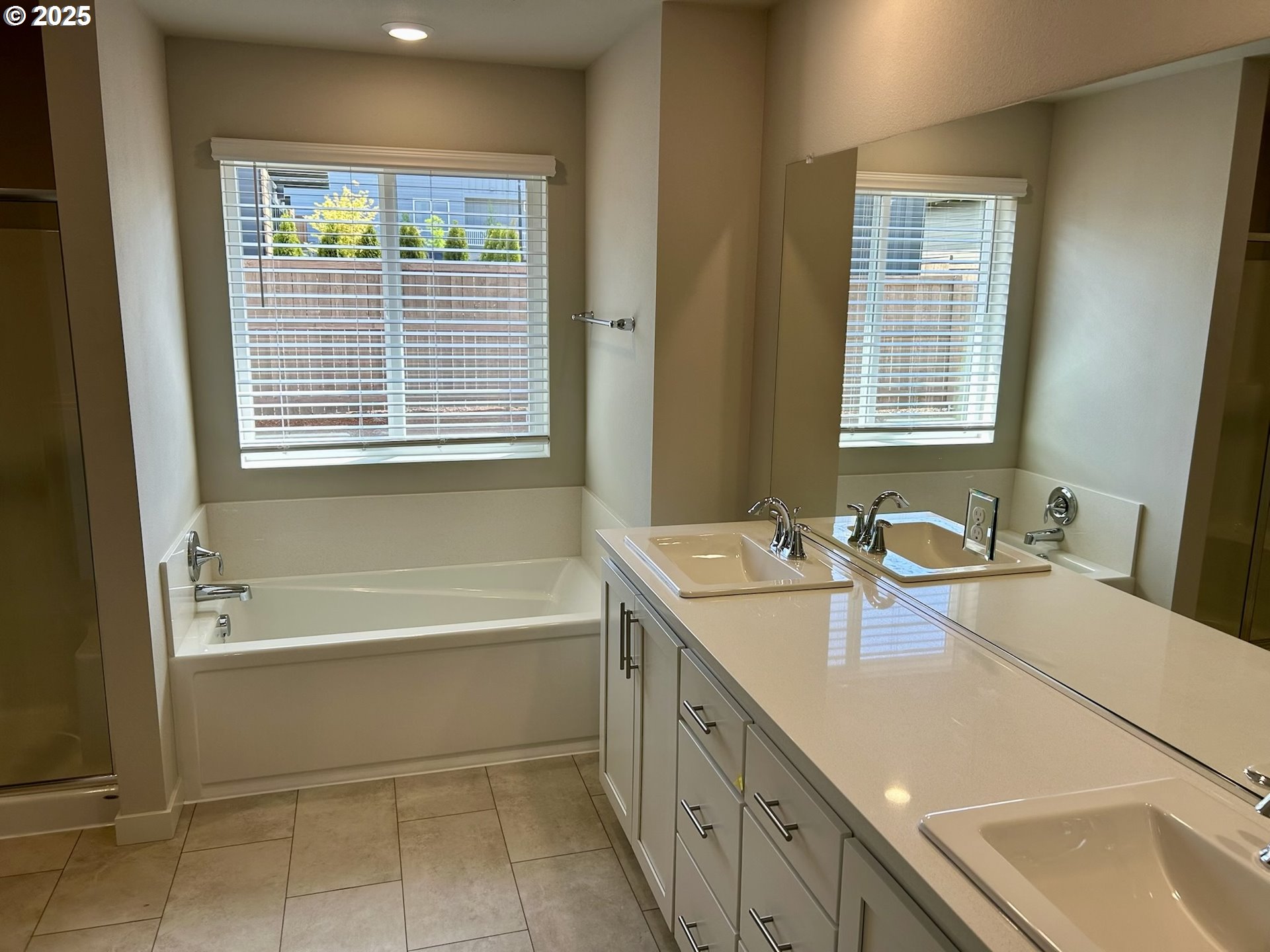 14956 Southwest 165th Avenue Tigard, OR 97224 - Photo 33 of 43 a bathroom with a tub sink and mirror