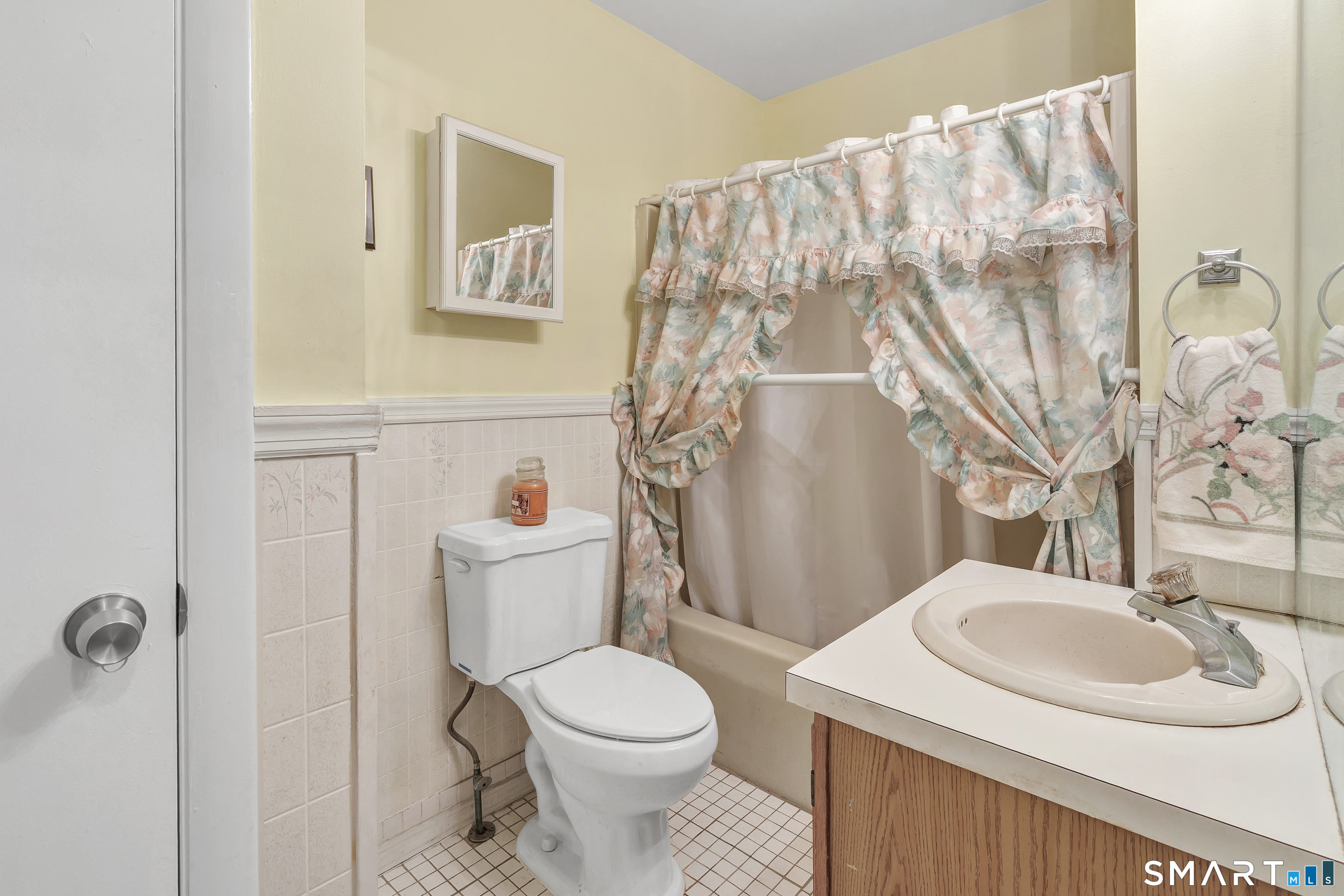123 River Road Shelton, CT 06484 - Photo 10 of 27 a bathroom with a sink a toilet and a mirror