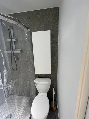 a bathroom with a toilet and a sink