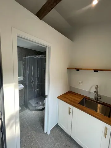 a kitchen with a sink and cabinets