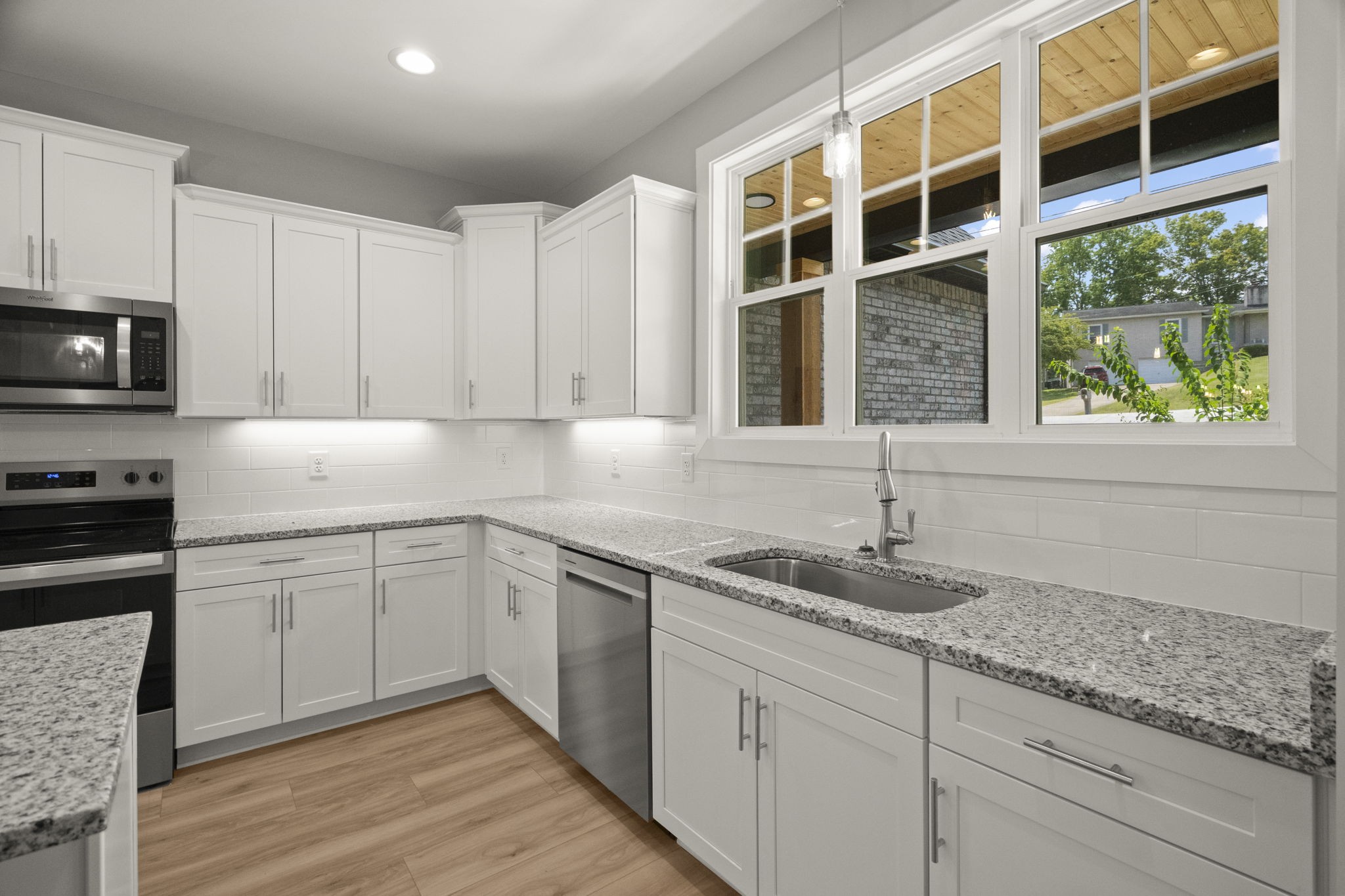 4062 Summit Drive Greenbrier, TN 37073 - Photo 11 of 36 a kitchen with granite countertop cabinets stainless steel appliances and a sink