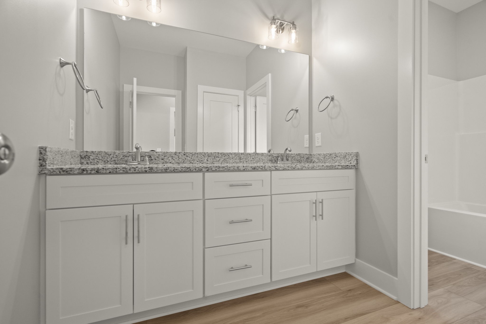 4062 Summit Drive Greenbrier, TN 37073 - Photo 21 of 36 a bathroom with a granite countertop double vanity sink and mirror