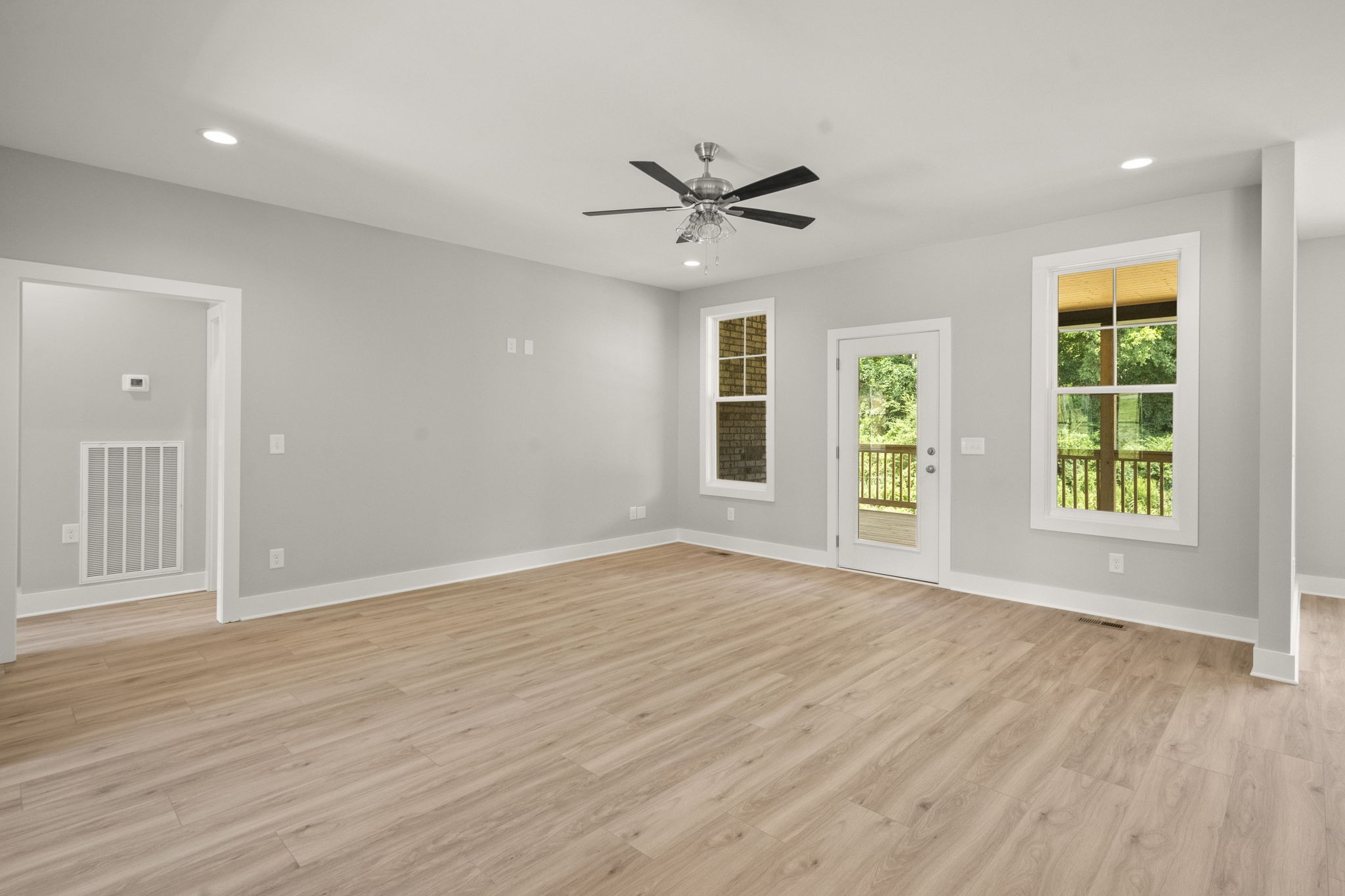 4062 Summit Drive Greenbrier, TN 37073 - Photo 4 of 36 a view of an empty room with a window and wooden floor