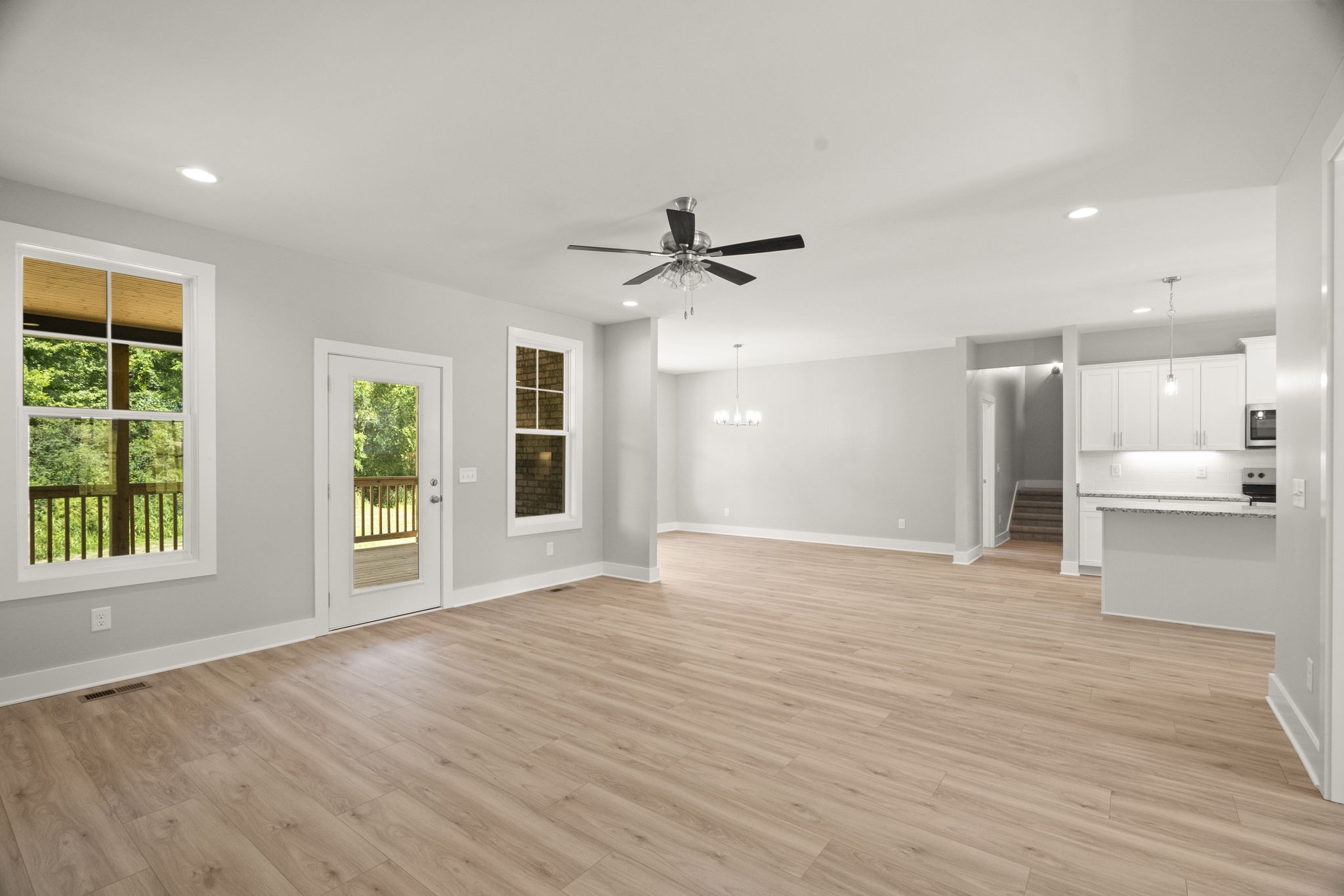 4062 Summit Drive Greenbrier, TN 37073 - Photo 6 of 36 a view of an empty room with a window and wooden floor