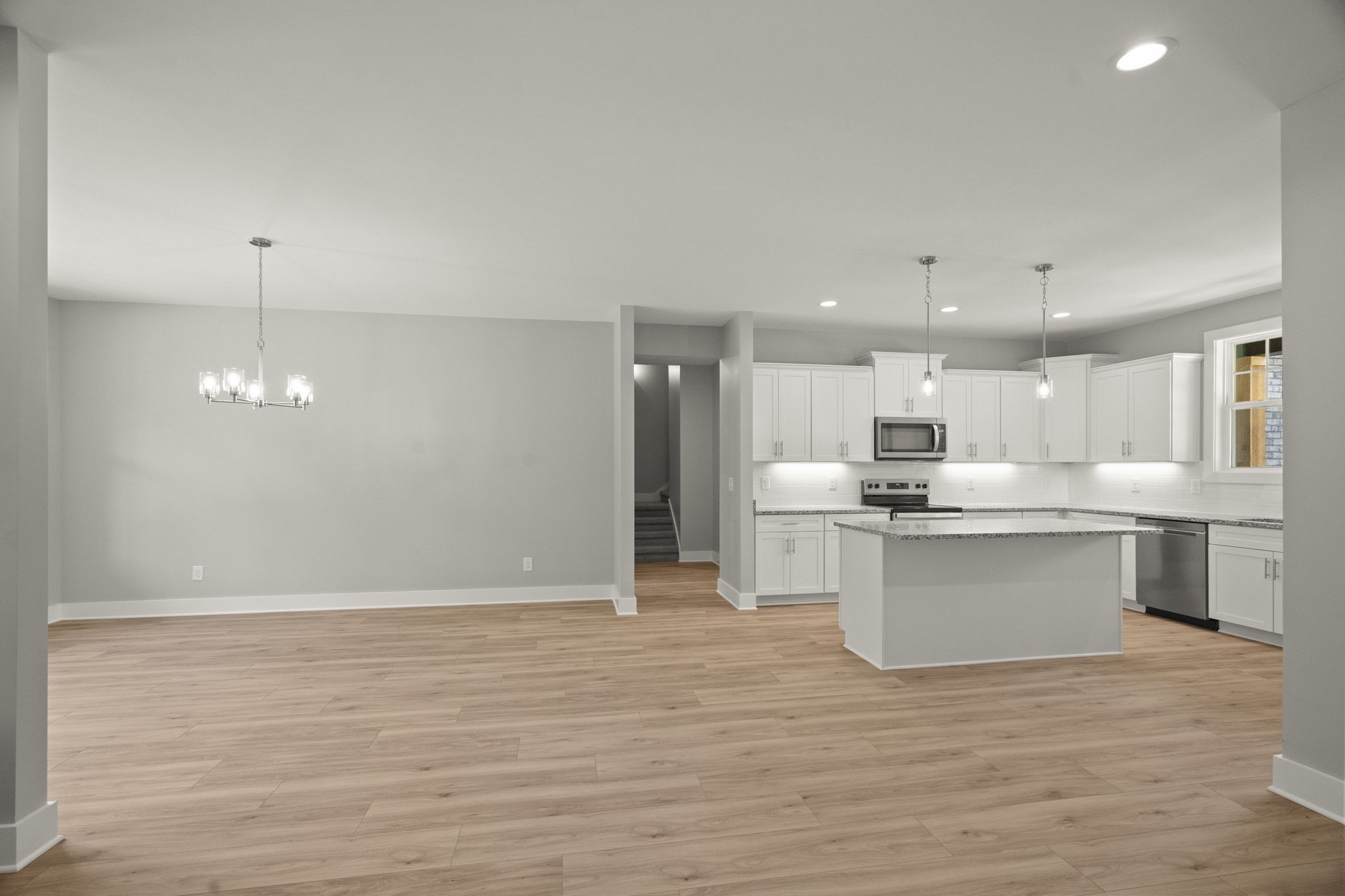4062 Summit Drive Greenbrier, TN 37073 - Photo 7 of 36 a view of kitchen with granite countertop refrigerator oven a sink and white cabinets