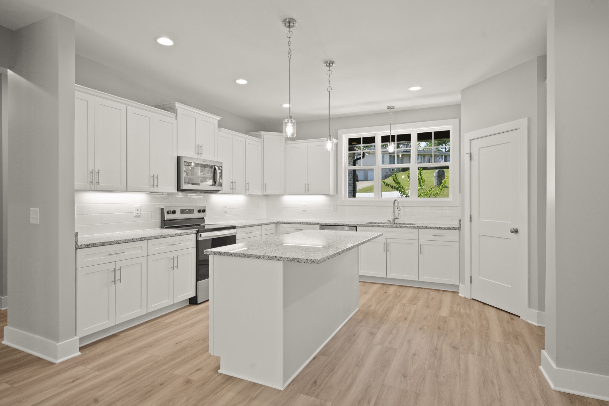 4062 Summit Drive Greenbrier, TN 37073 - Photo 8 of 36 a kitchen with white cabinets and white appliances