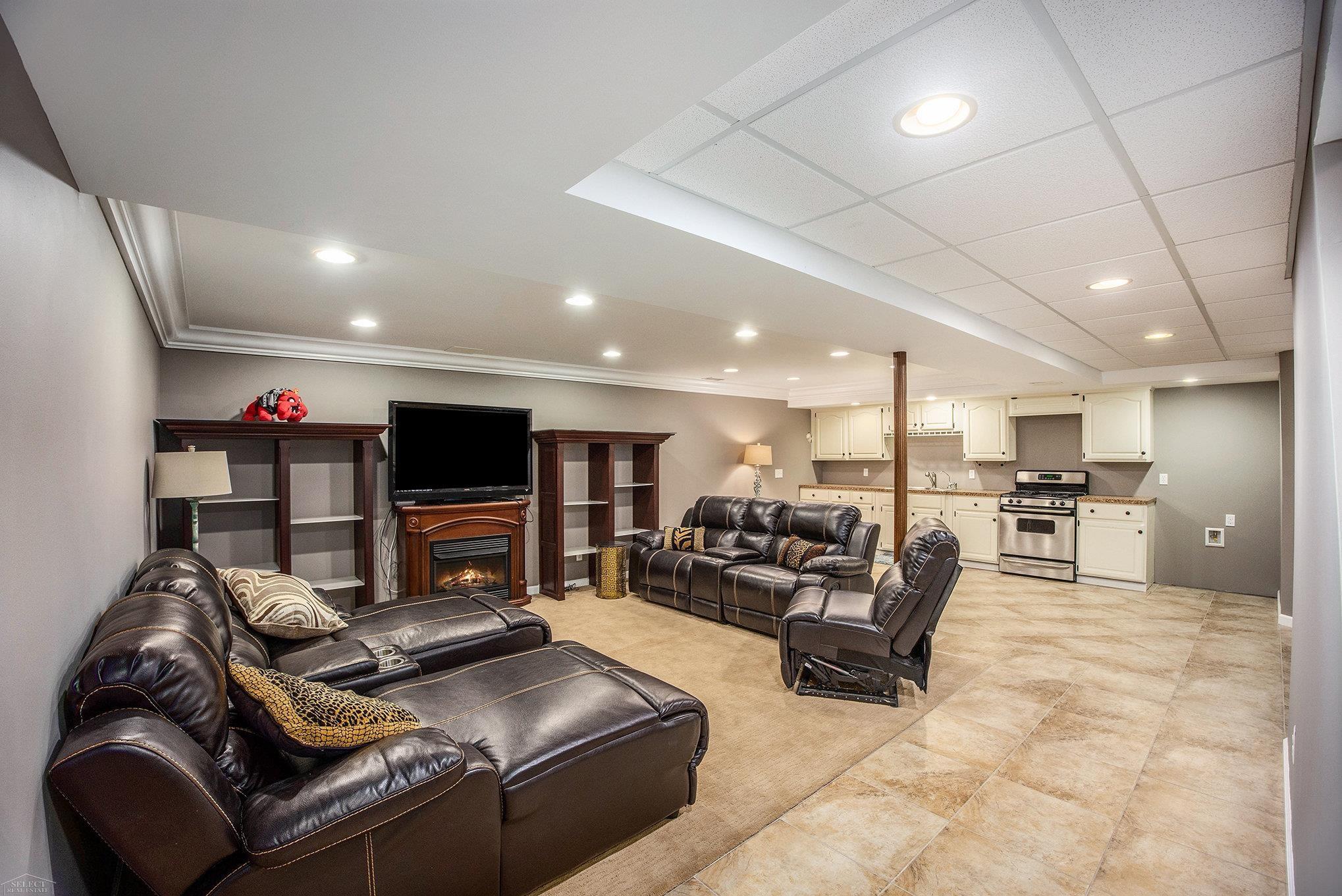 411 Ewell Street Romeo, MI 48065 - Photo 11 of 17 Finished basement with fireplace