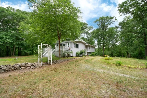 a house view with a backyard space