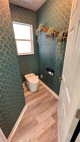 a bathroom with a sink mirror and view