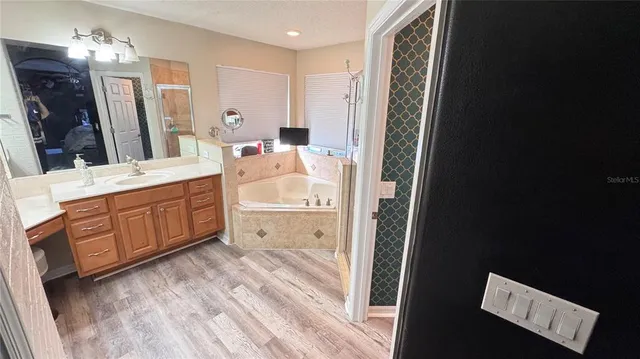 a bedroom with furniture and a chandelier