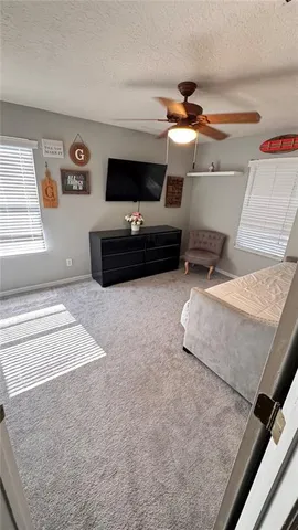 a living room with furniture a lamp and a fireplace
