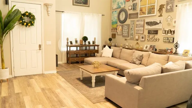 a living room with furniture and a rug