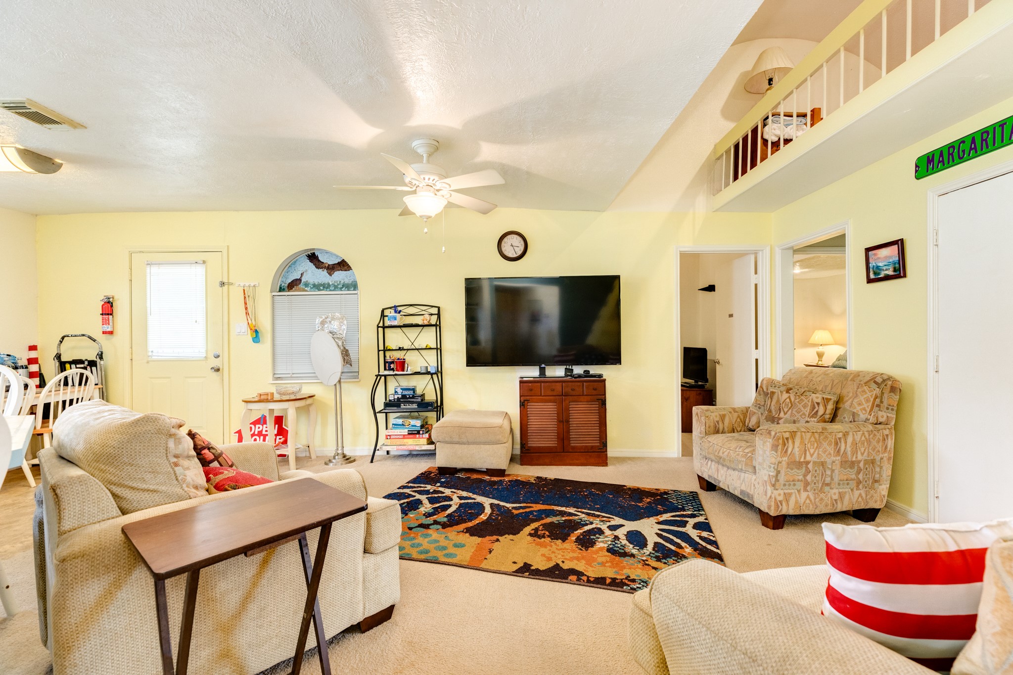 211 Pompano Lane Surfside Beach, TX 77541 - Photo 20 of 44 a living room with furniture and a flat screen tv