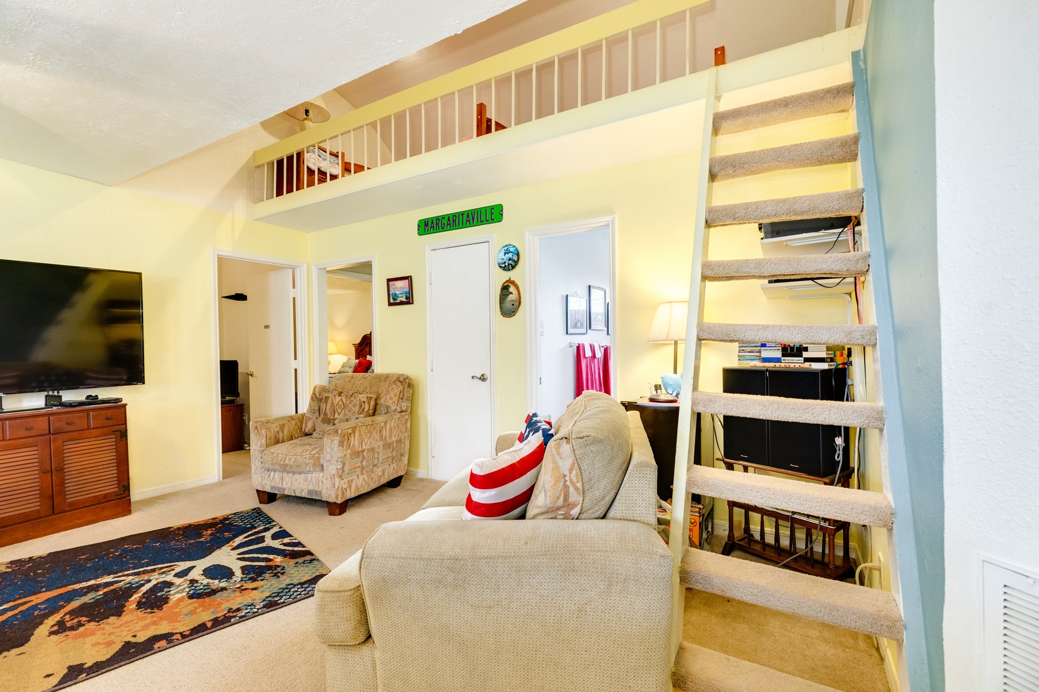 211 Pompano Lane Surfside Beach, TX 77541 - Photo 21 of 44 a bedroom with furniture and a flat screen tv