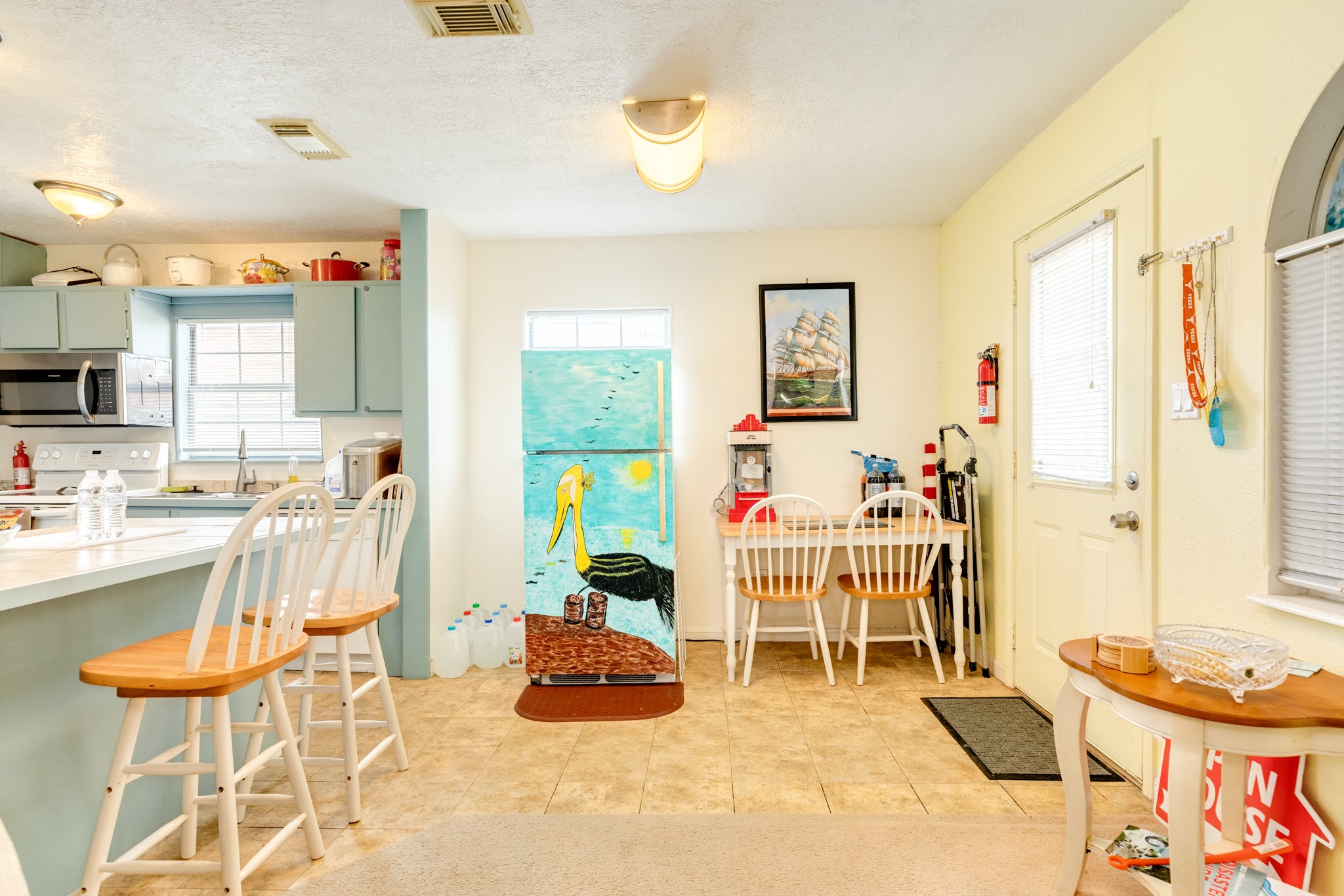 211 Pompano Lane Surfside Beach, TX 77541 - Photo 22 of 44 a very nice looking room with a large window and dining table
