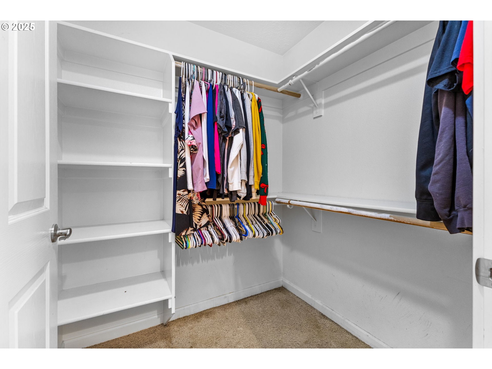 610 Northwest Hillcrest Drive Dallas, OR 97338 - Photo 22 of 32 a view of walk in closet with clothes and shoes