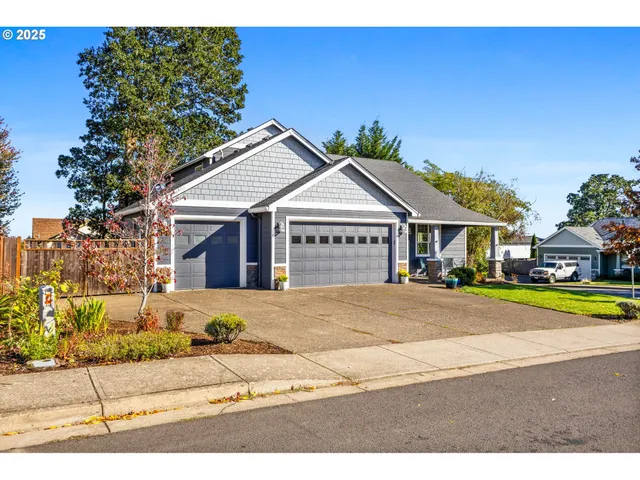 a front view of a house with a garden