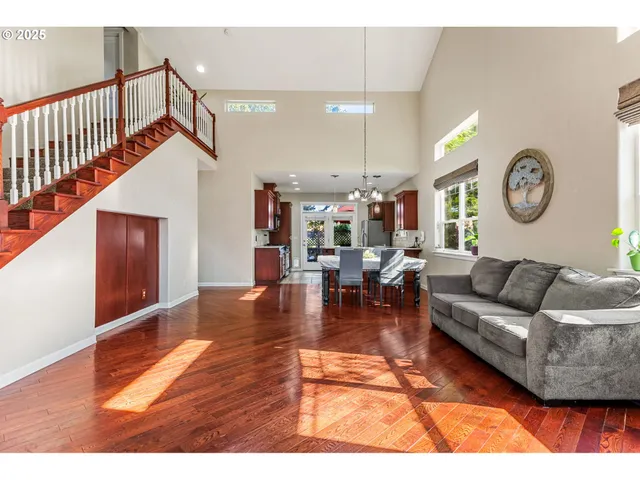 a living room with furniture and a clock
