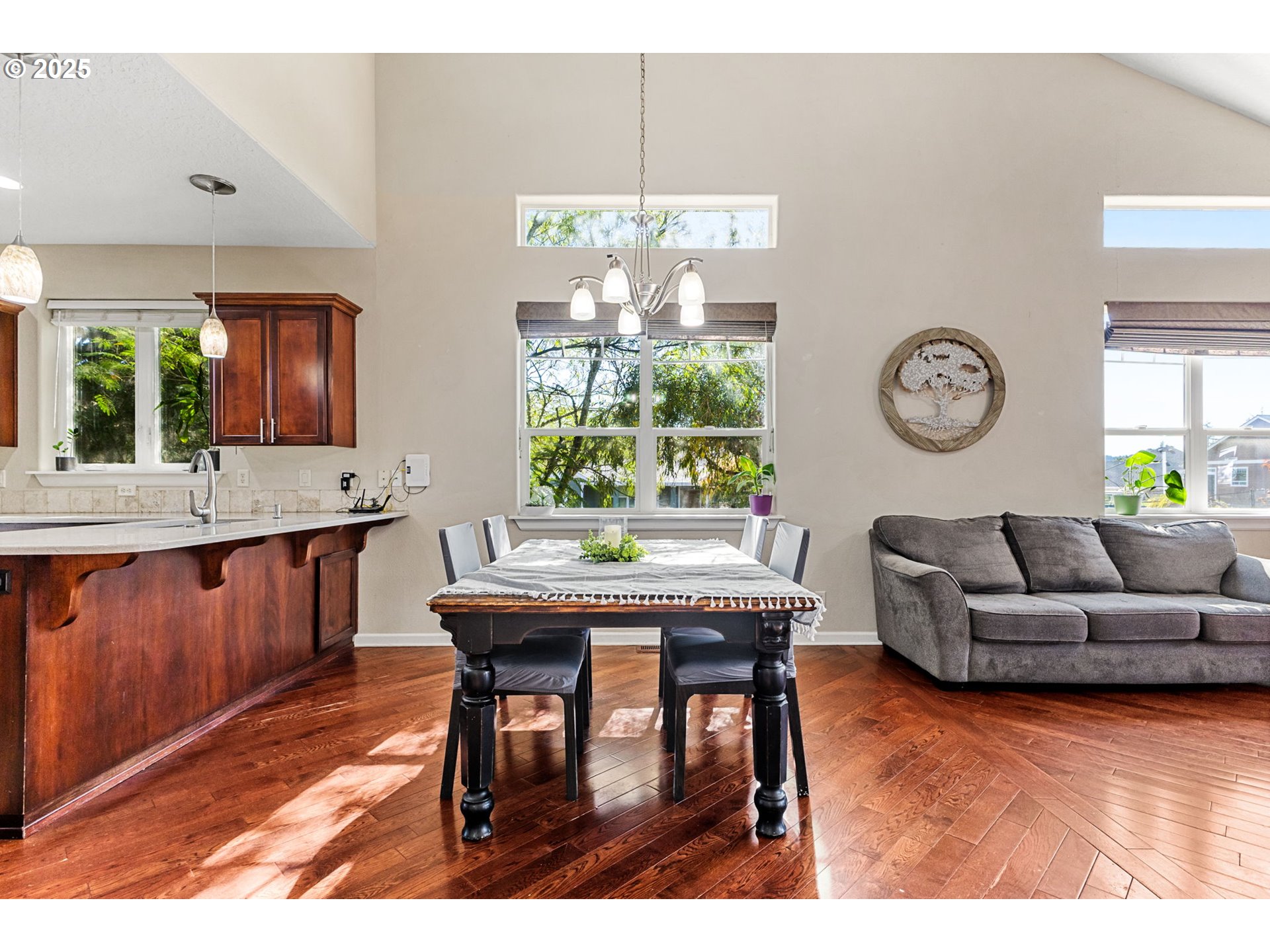 610 Northwest Hillcrest Drive Dallas, OR 97338 - Photo 7 of 32 a living room with furniture a window and a dining table