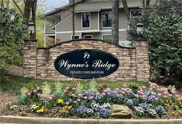 a view of a house with a flower garden