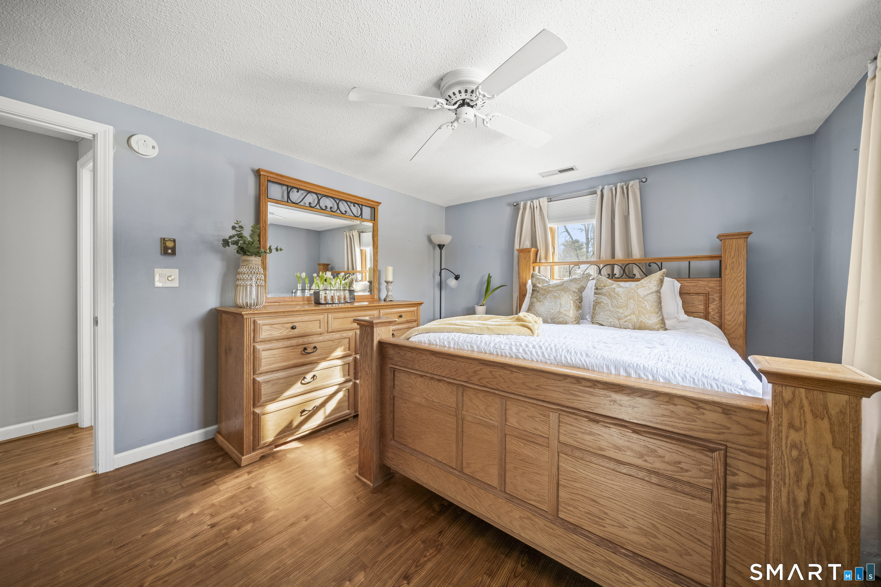 51 Barrett Road Enfield, CT 06082 - Photo 16 of 35 a bedroom with a bed and a dresser