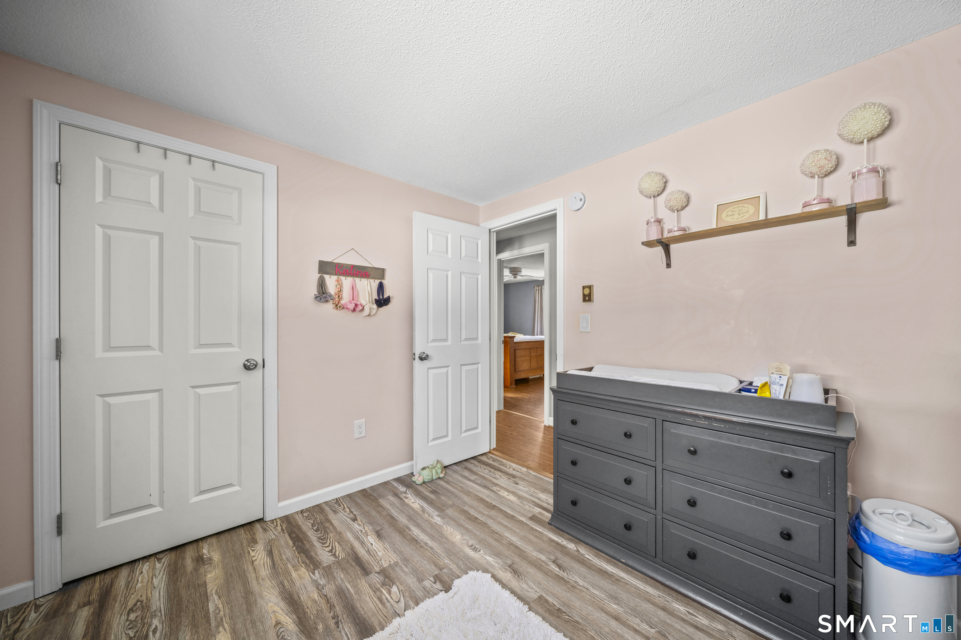 51 Barrett Road Enfield, CT 06082 - Photo 19 of 35 a view of a dresser with wooden floor