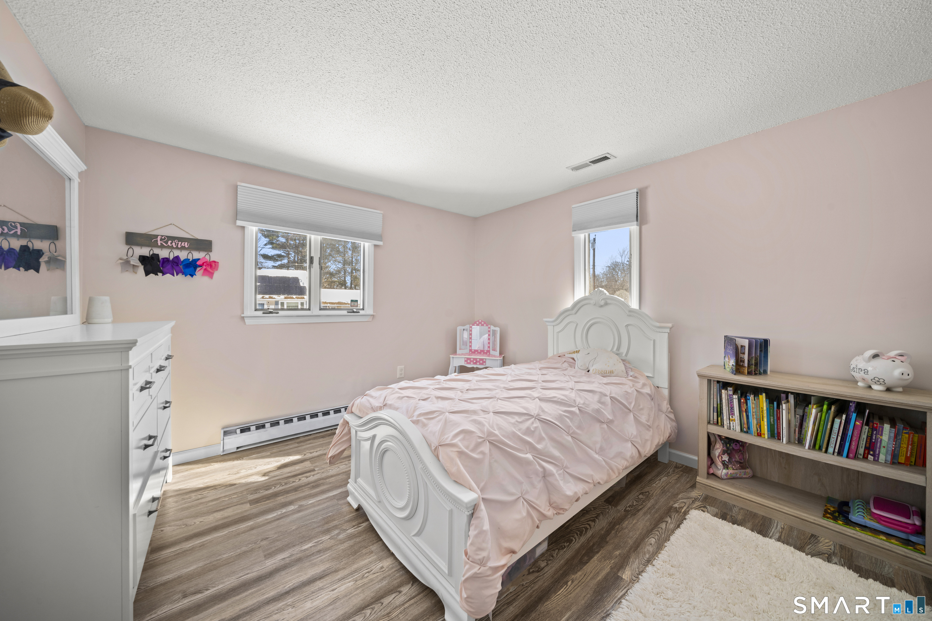 51 Barrett Road Enfield, CT 06082 - Photo 21 of 35 a bedroom with a bed and a book shelf