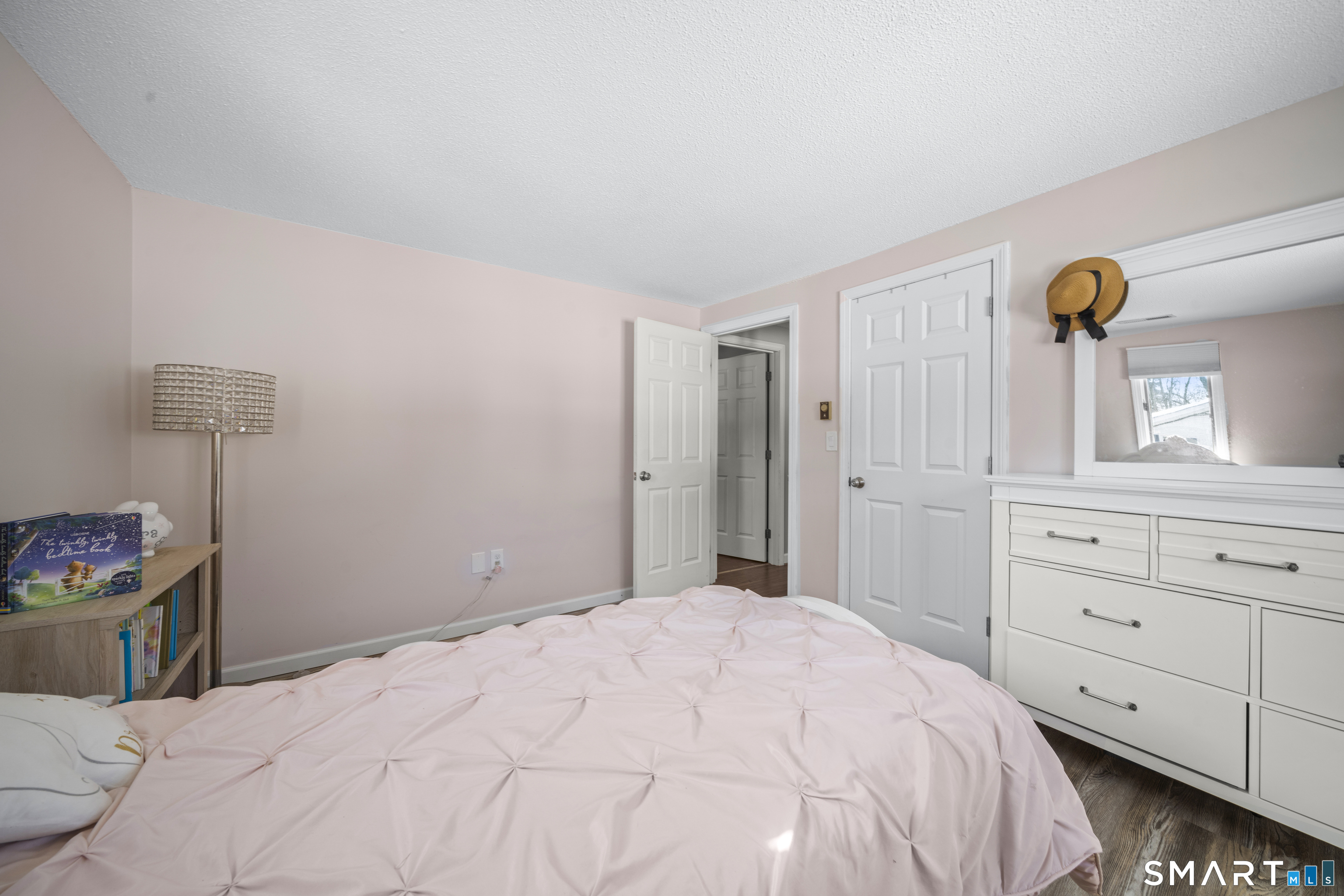 51 Barrett Road Enfield, CT 06082 - Photo 23 of 35 a bedroom with a bed and a dresser