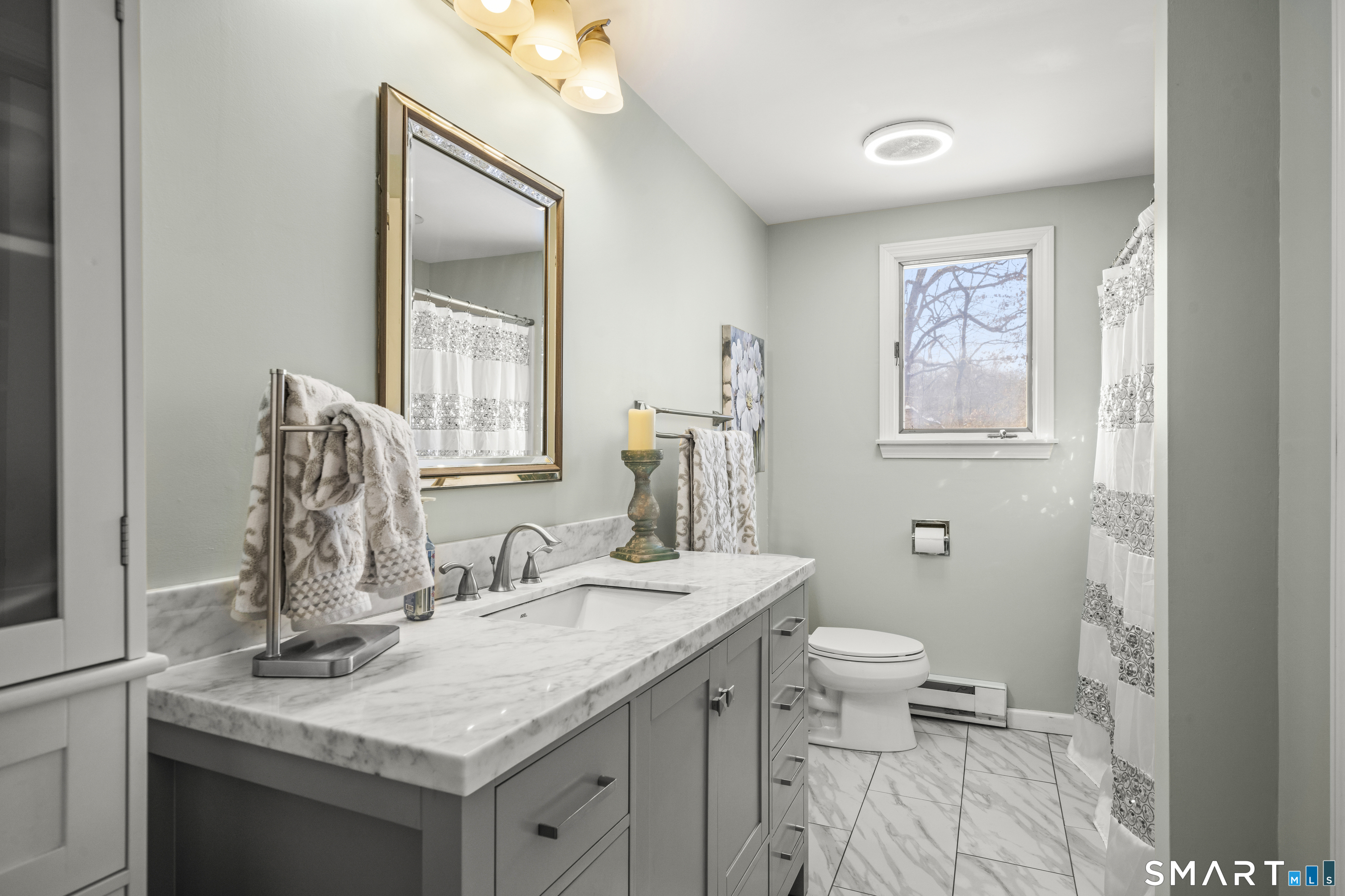 51 Barrett Road Enfield, CT 06082 - Photo 24 of 35 a bathroom with a granite countertop sink and a mirror