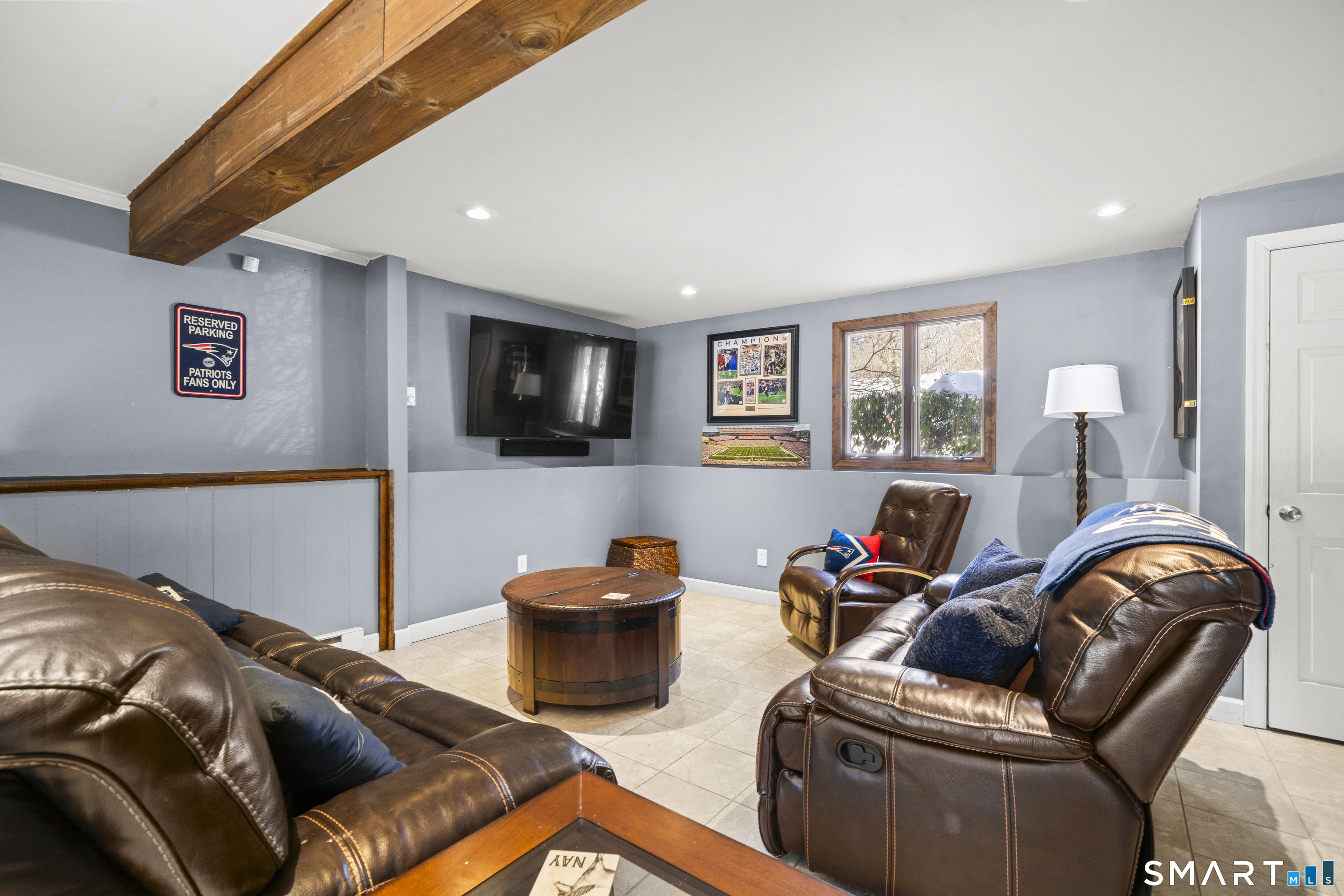 51 Barrett Road Enfield, CT 06082 - Photo 26 of 35 a living room with furniture and a flat screen tv