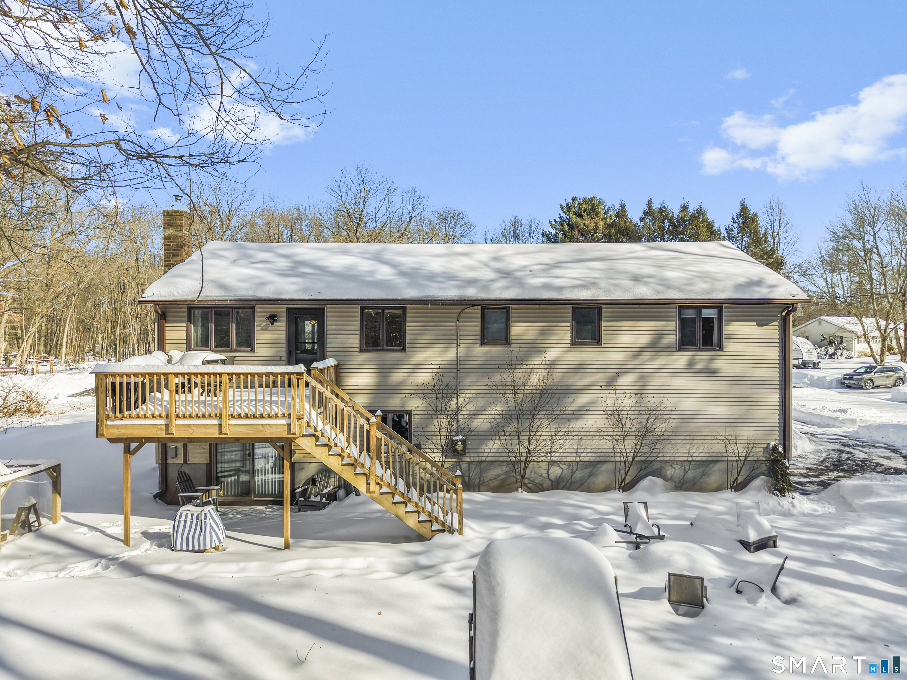 51 Barrett Road Enfield, CT 06082 - Photo 3 of 35 a view of a patio with table and chairs with wooden floor and fence