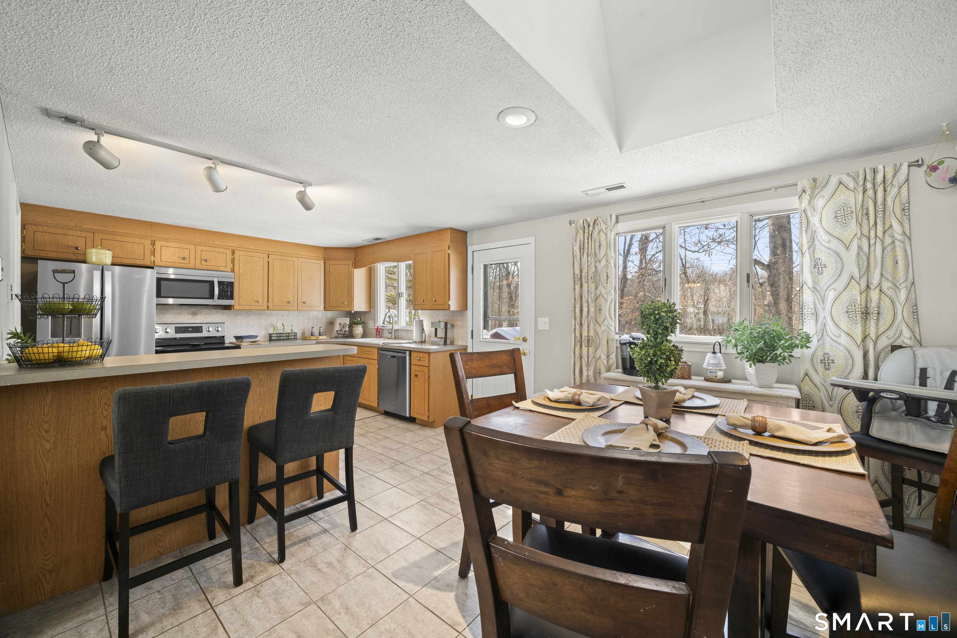 51 Barrett Road Enfield, CT 06082 - Photo 9 of 35 a view of a dining room with furniture window and outside view