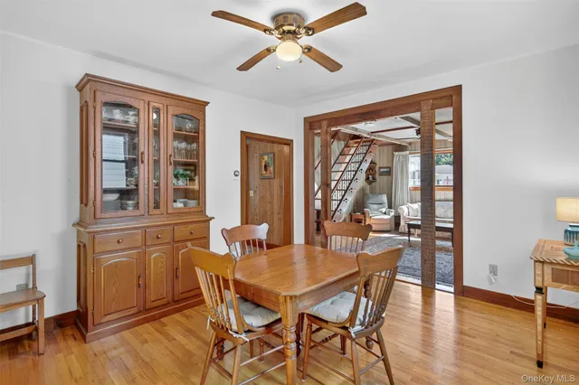a dining room with furniture window wooden floor