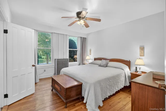 a bed room with a bed and a window