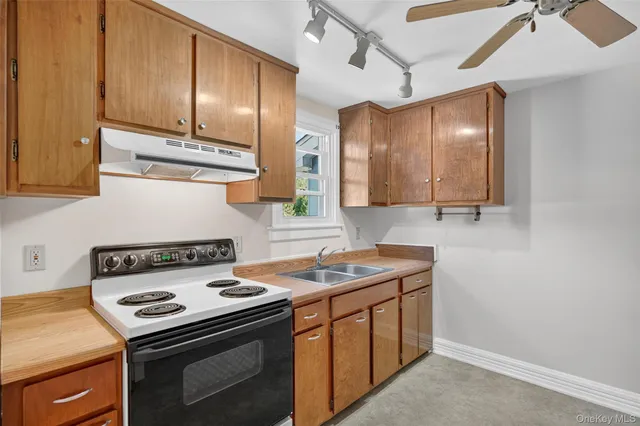 a kitchen with a stove and a sink