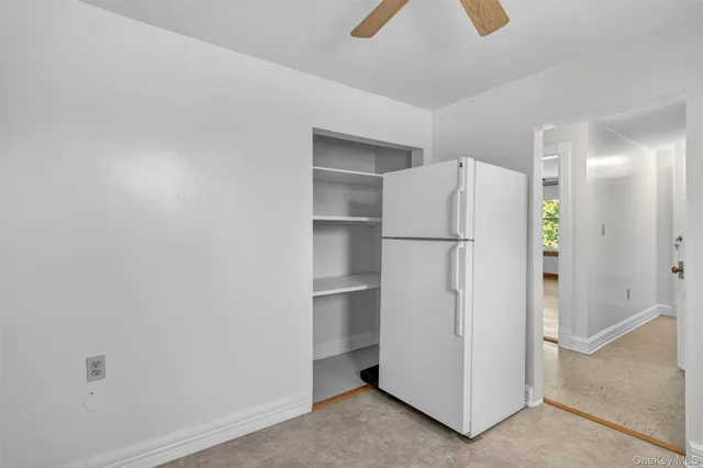 a refrigerator freezer sitting in a kitchen