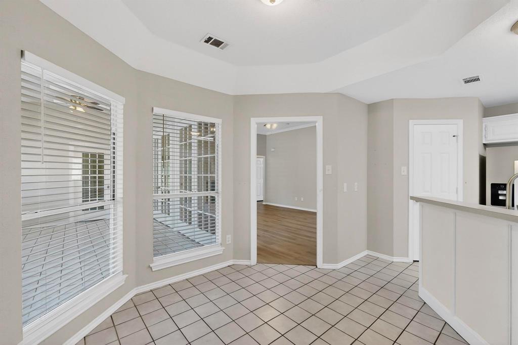 2601 Trail Tree Court Burleson, TX 76028 - Photo 18 of 40 Unfurnished dining area featuring light tile patterned floors