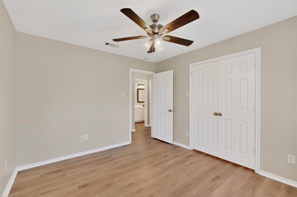 2601 Trail Tree Court Burleson, TX 76028 - Photo 30 of 40 Unfurnished bedroom with light wood finished floors, a closet, and ceiling fan